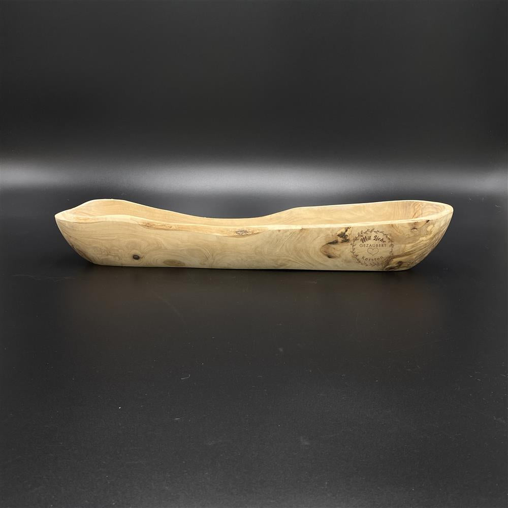 Brotschale aus Olivenholz – stilvolles und funktionales Küchenaccessoire.
Länge ca. 40 cm, Breite 9–11 cm, Höhe 6–10 cm – perfekt für Brot und Baguette.
Lasergravur „Mit Liebe gezaubert“ oder personalisiert mit Wunschnamen für ein einzigartiges Geschenk.
Natürliche Maserung des Olivenholzes sorgt für eine warme, edle Optik in jeder Küche.
Ideales Geschenk für Freunde, Familie oder zum Geburtstag – praktisch und dekorativ zugleich.